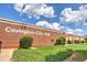 The brick exterior of Covington City Hall is framed by lush greenery under a partly cloudy sky at 1257 Pj East Rd, Covington, GA 30014
