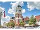 Exterior view of the county courthouse featuring clock tower, with surrounding street, trees, and vehicles at 1257 Pj East Rd, Covington, GA 30014