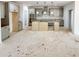A bright and airy kitchen with gray cabinets, an island, and modern fixtures at 1257 Pj East Rd, Covington, GA 30014
