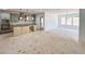 A bright and airy kitchen with gray cabinets, an island, and modern fixtures at 1257 Pj East Rd, Covington, GA 30014