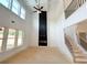 Spacious living room with soaring ceilings, large windows, and a modern black fireplace at 1257 Pj East Rd, Covington, GA 30014