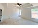 Large main bedroom with trey ceiling, large windows providing natural light, and modern trim at 1257 Pj East Rd, Covington, GA 30014