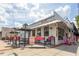 Attractive retail building with outdoor seating and a bright pink awning at 1257 Pj East Rd, Covington, GA 30014