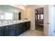 Double vanity bathroom with view into bedroom at 3126 Cove View Court, Dacula, GA 30019