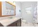 Simple bathroom with granite countertop and nautical-themed shower curtain at 673 Windsor Sw St, Atlanta, GA 30310