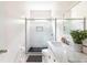 Clean bathroom with a white subway tile shower and marble countertop at 673 Windsor Sw St, Atlanta, GA 30310