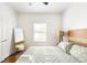 Comfortable bedroom with a king-size bed and full-length mirror at 673 Windsor Sw St, Atlanta, GA 30310