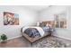 Charming bedroom with a wood bed frame and tiger artwork at 673 Windsor Sw St, Atlanta, GA 30310