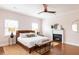 Spacious bedroom with a king-size bed, fireplace, and hardwood floors at 673 Windsor Sw St, Atlanta, GA 30310