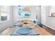 Bright dining room featuring a long wooden table and modern decor at 673 Windsor Sw St, Atlanta, GA 30310