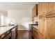Modern kitchen with stainless steel appliances and light wood cabinets at 673 Windsor Sw St, Atlanta, GA 30310