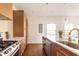 Modern kitchen with white countertops, wooden cabinets, and a large island at 673 Windsor Sw St, Atlanta, GA 30310