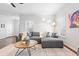 Spacious living room with sectional sofa and hardwood floors at 673 Windsor Sw St, Atlanta, GA 30310
