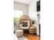 Relaxing living room with a wicker egg chair and wooden accents at 673 Windsor Sw St, Atlanta, GA 30310