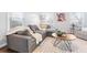 Cozy living room featuring a sectional sofa, coffee table, and stylish decor at 673 Windsor Sw St, Atlanta, GA 30310
