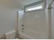 Clean bathroom featuring a bathtub and shower at 1890 Cobblefield Cir, Dacula, GA 30019