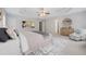 Bright bedroom featuring tray ceilings, neutral walls, carpet, and large windows providing ample natural light at 2166 Waterford Park Dr, Lawrenceville, GA 30044