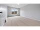 Bedroom with neutral walls and carpet, and window providing natural light at 2166 Waterford Park Dr, Lawrenceville, GA 30044