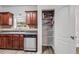 Kitchen with stainless steel dishwasher, wood cabinets, and a walk-in pantry at 2166 Waterford Park Dr, Lawrenceville, GA 30044