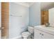 Light blue bathroom with tiled shower and vanity at 577 Reed Se St, Atlanta, GA 30312