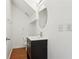 Clean bathroom with dark vanity and oval mirror at 577 Reed Se St, Atlanta, GA 30312