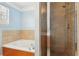 Clean bathroom featuring a shower and garden tub at 577 Reed Se St, Atlanta, GA 30312