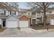 Three-unit townhouse building with attached garages and landscaping at 577 Reed Se St, Atlanta, GA 30312
