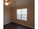 Bright bedroom featuring hardwood floors and a ceiling fan at 1101 Mill Pond Se Dr, Smyrna, GA 30082