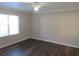 Bright bedroom with hardwood floors and ceiling fan at 1101 Mill Pond Se Dr, Smyrna, GA 30082