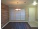 Dining room with wood accent wall and chandelier at 1101 Mill Pond Se Dr, Smyrna, GA 30082