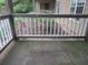 Small back porch with white railing at 1101 Mill Pond Se Dr, Smyrna, GA 30082
