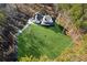 Aerial view of a home showcasing expansive lawn and wooded surroundings at 3505 Moss Landing Rd, Acworth, GA 30102