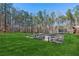 Large backyard with concrete slab and trampoline at 3505 Moss Landing Rd, Acworth, GA 30102