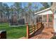 Deck overlooks fenced backyard with trampoline at 3505 Moss Landing Rd, Acworth, GA 30102