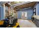 Partially finished basement with workshop area and double doors at 3505 Moss Landing Rd, Acworth, GA 30102