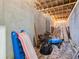Unfinished basement with various items and building materials at 3505 Moss Landing Rd, Acworth, GA 30102