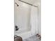 Simple bathroom with white subway tile and tub at 3505 Moss Landing Rd, Acworth, GA 30102