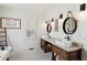 Bathroom boasts double sinks, rustic vanity, and white hex tile at 3505 Moss Landing Rd, Acworth, GA 30102