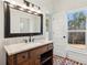 Bathroom boasts a rustic vanity and brick floor at 3505 Moss Landing Rd, Acworth, GA 30102
