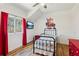 Bedroom with red curtains and Spiderman wall art at 3505 Moss Landing Rd, Acworth, GA 30102