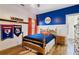 Baseball-themed bedroom with hardwood floors at 3505 Moss Landing Rd, Acworth, GA 30102