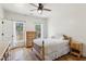 Bright bedroom with hardwood floors and window views at 3505 Moss Landing Rd, Acworth, GA 30102