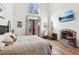 Spacious bedroom with fireplace, hardwood floors, and access to deck at 3505 Moss Landing Rd, Acworth, GA 30102