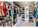 Large walk-in closet with ample shelving and hanging space at 3505 Moss Landing Rd, Acworth, GA 30102