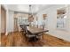 Formal dining room featuring hardwood floors and a rustic farmhouse table at 3505 Moss Landing Rd, Acworth, GA 30102