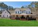 White farmhouse with large porch and lush green lawn at 3505 Moss Landing Rd, Acworth, GA 30102