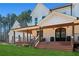 Farmhouse with a large front porch and double front doors at 3505 Moss Landing Rd, Acworth, GA 30102