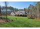 Farmhouse with wrap-around porch and beautiful landscaping at 3505 Moss Landing Rd, Acworth, GA 30102