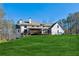 White farmhouse with large backyard and deck at 3505 Moss Landing Rd, Acworth, GA 30102