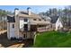 Two-story white house with large deck, screened porch, and expansive backyard at 3505 Moss Landing Rd, Acworth, GA 30102